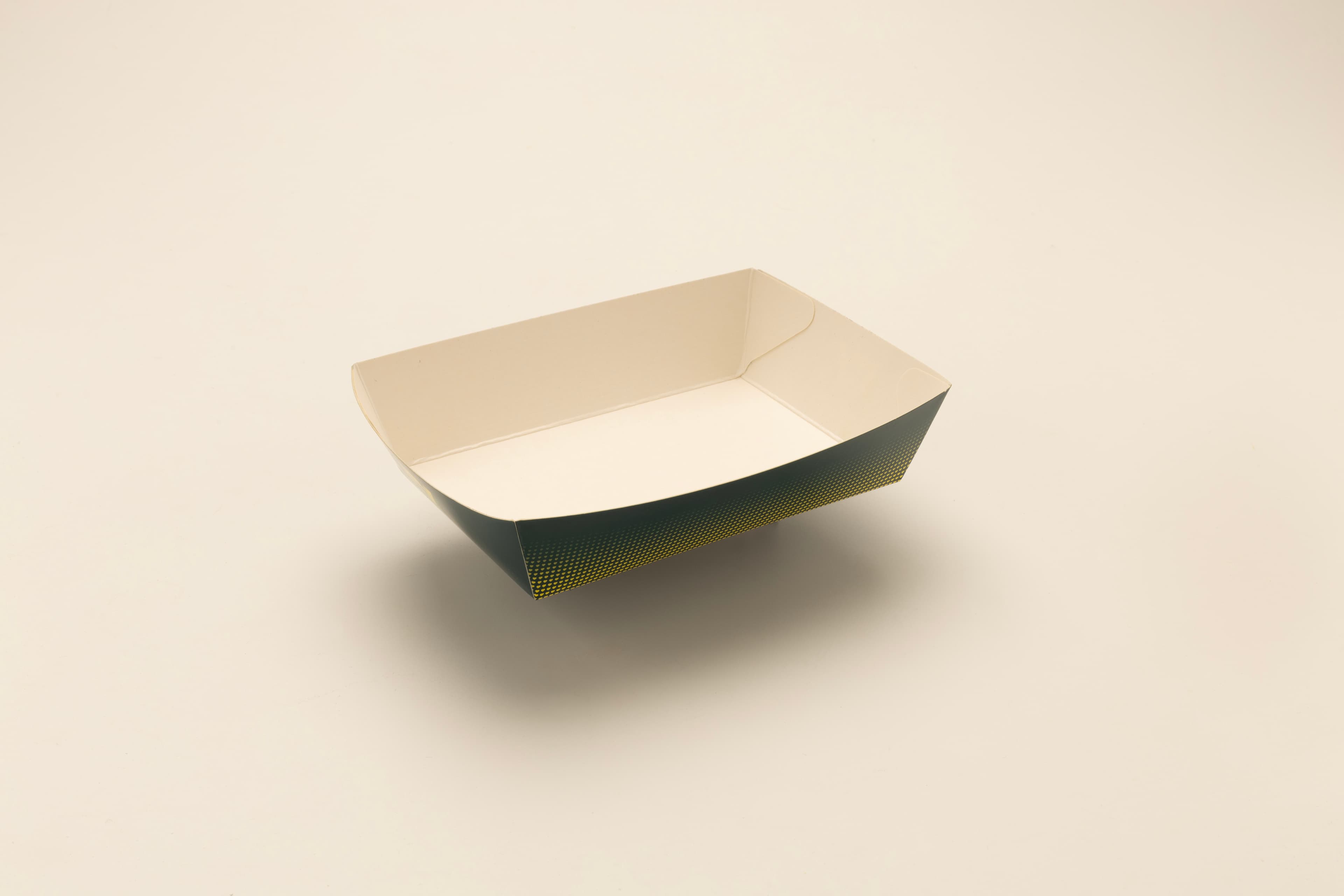 Printed paperboard food service tray with halftone detail on the outer wall